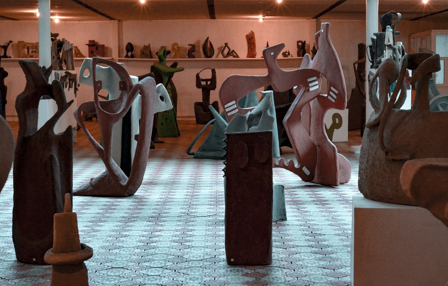 Abstract sculptures on display in a bright art gallery.